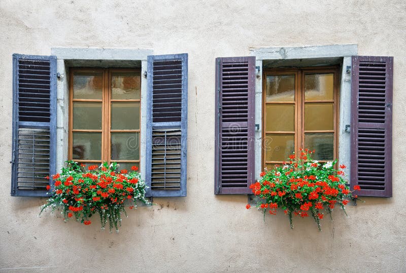 Old windows on plastered brick wall