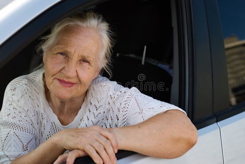 Old woman in the car