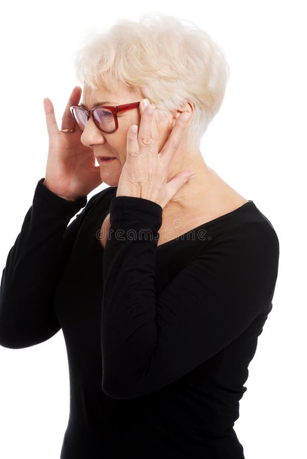 An Old Woman is Eye Glasses is Having a Headache. Stock Image Image