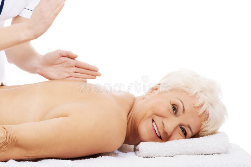 An old woman is having a massage. Spa concept. royalty free stock images An old woman is having a massage. Spa concept. royalty free stock images