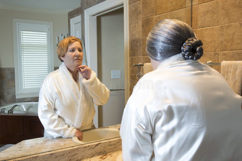 Old Woman Looking at Younger Reflection in Mirror Stock Image - Image ...