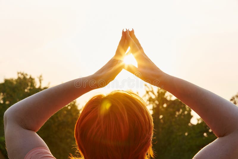 Old woman meditating in the park stock photos