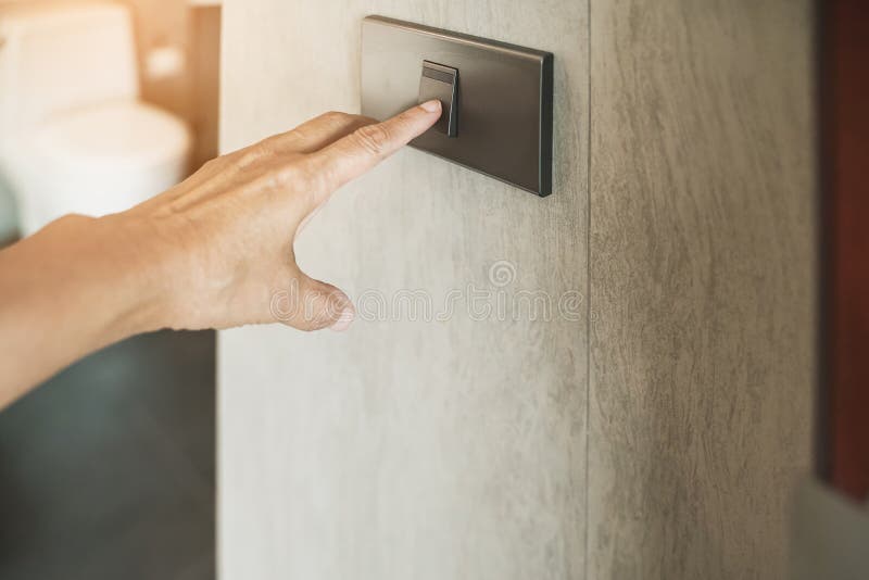 old woman`s hand turned on switch to open light in toilet royalty free stock photos old woman`s hand turned on switch to open light in toilet royalty free stock photos