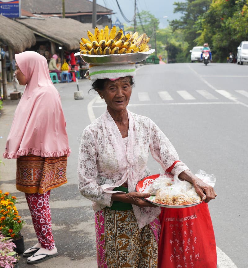 Old woman selling bananas at the farmers market stock photos Old woman selling bananas at the farmers market stock photos