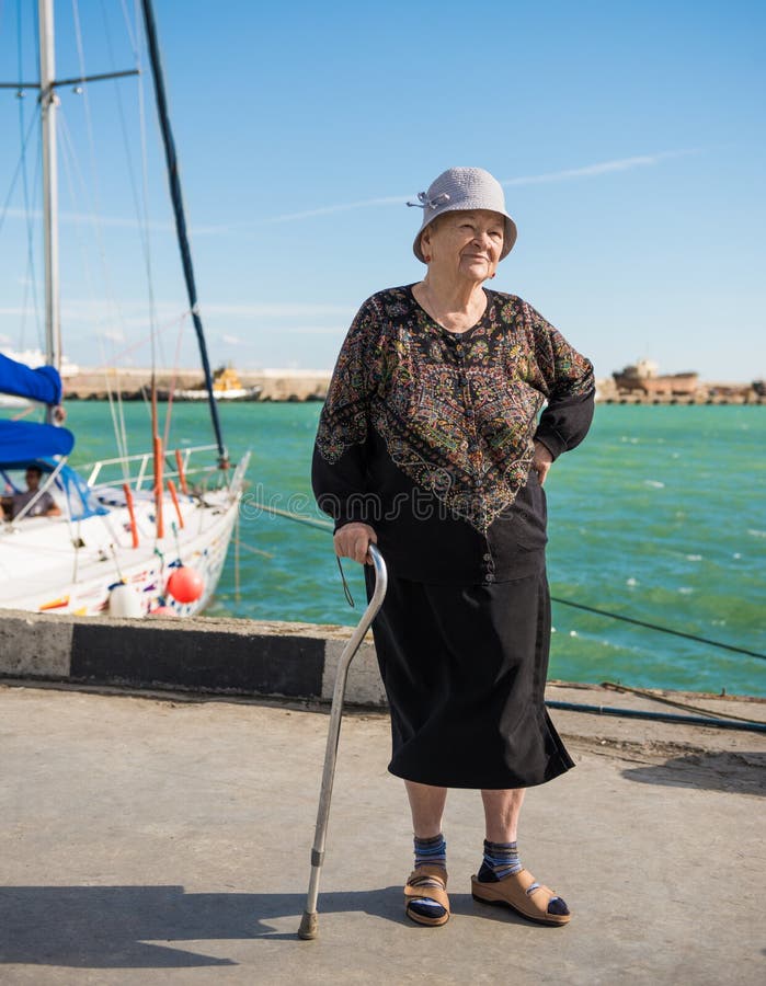 Old Woman Standing with a Cane Stock Image - Image of lifestyle, yalta