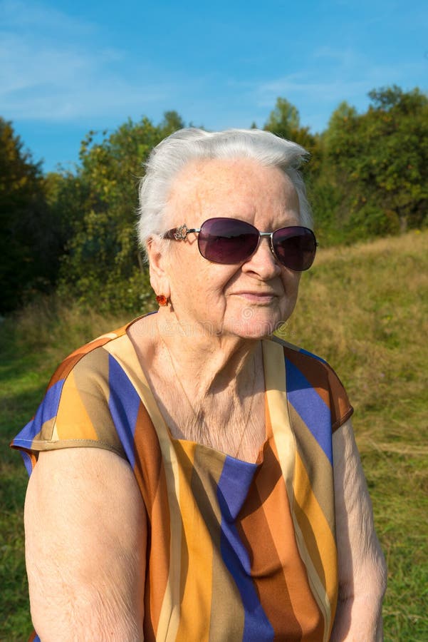 Old woman in sunglasses stock image. Image of glasses - 31809951