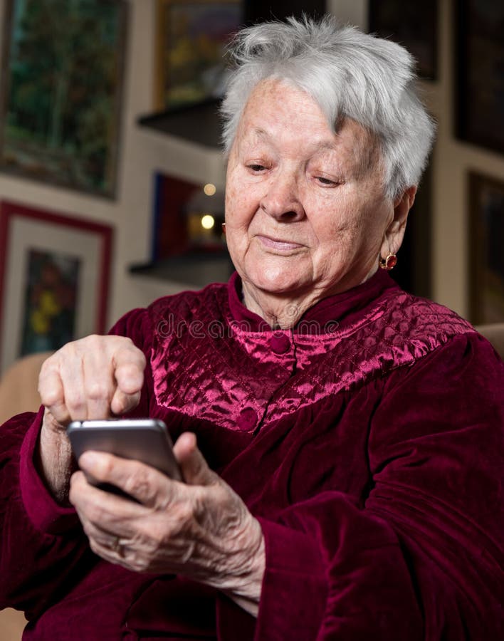 Old woman using smart phone royalty free stock photo Old woman using smart phone royalty free stock photo