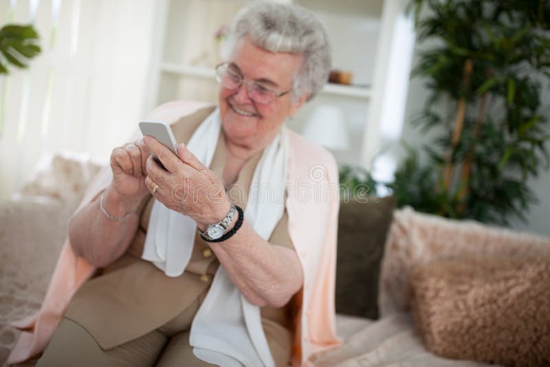 Old Woman Using a Smartphone Stock Photo - Image of cheerful, modern