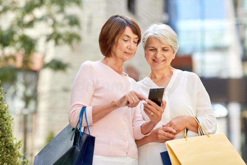 Old Women with Shopping Bags and Cellphone in City Stock Image - Image ...