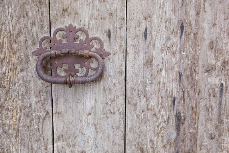 Old wood door with rusty handle