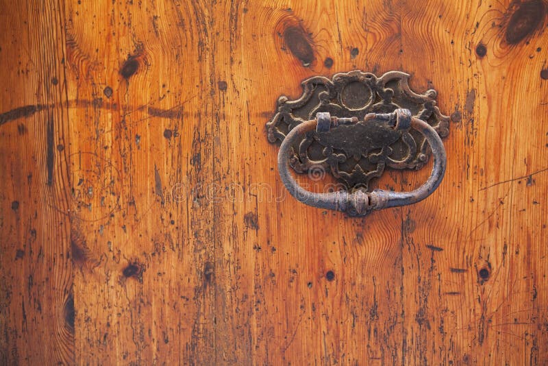 Old wood door with rusty handle