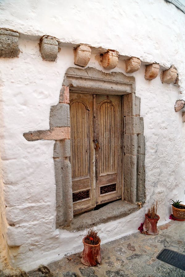 Old wood door in stone wall