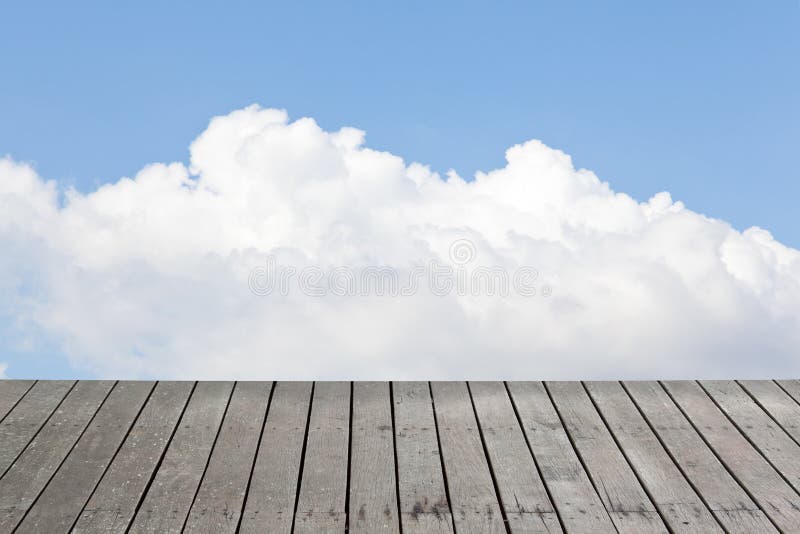 Old wood floor and cloudy sky