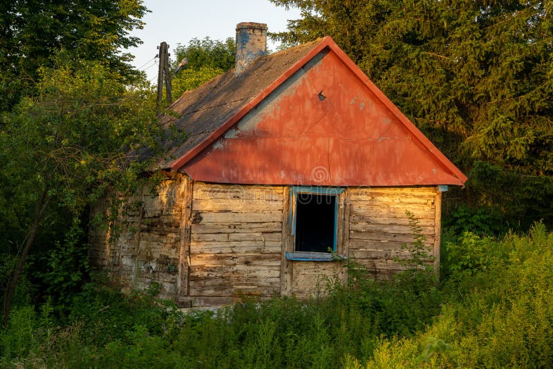 An Old, Wooden, Abandoned House with a Roof Covered with Very Harmful ...