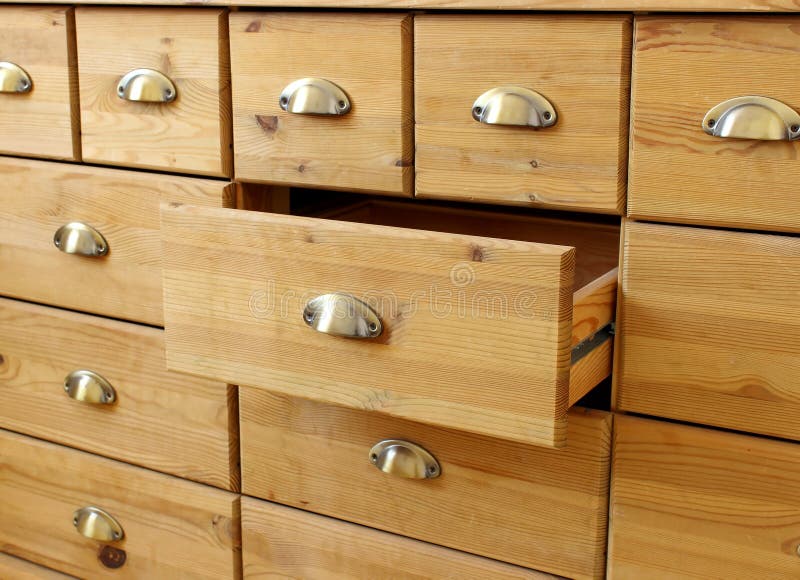 Old wooden antique chest of drawers with metal handles