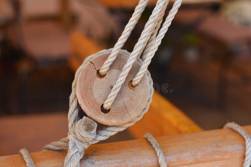 Old wooden block with rope stock image. Image of nautical 60921431