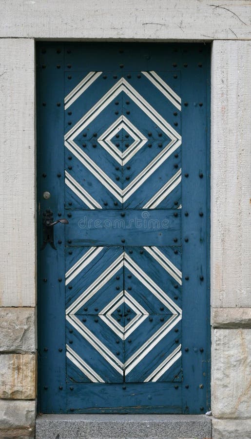 Old wooden blue door with ornament