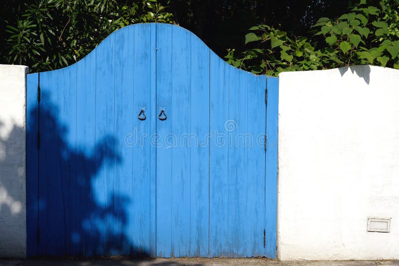 Old wooden blue gateway