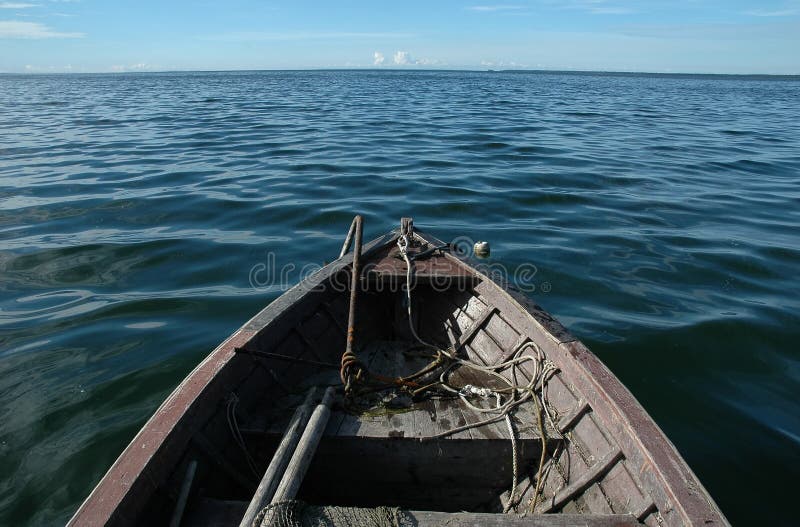 old wooden boat on sea stock image. image of anchor