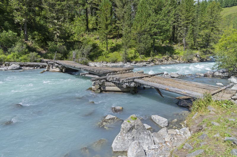 Old wooden bridge. Altai Mountains, Russia.