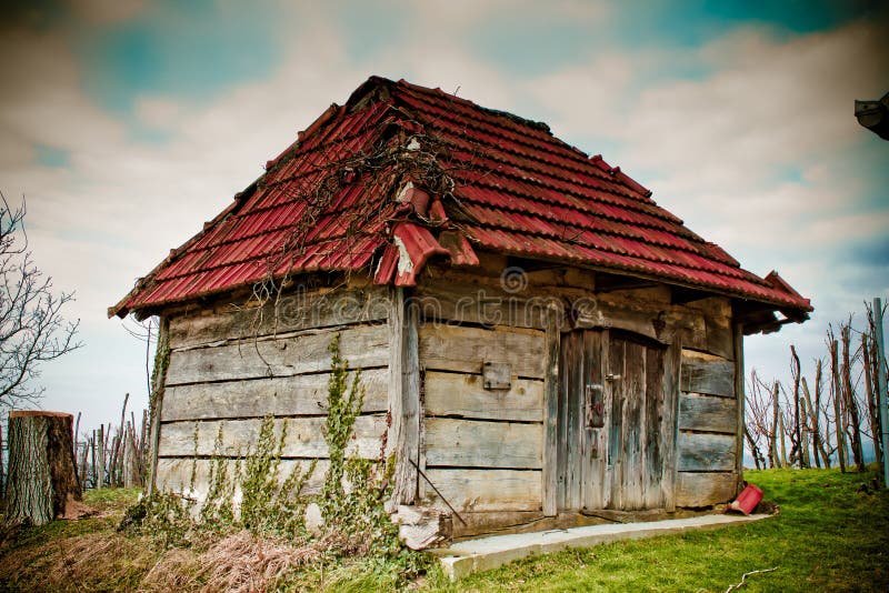 Old wooden cottage - traditional wine cellar stock photography