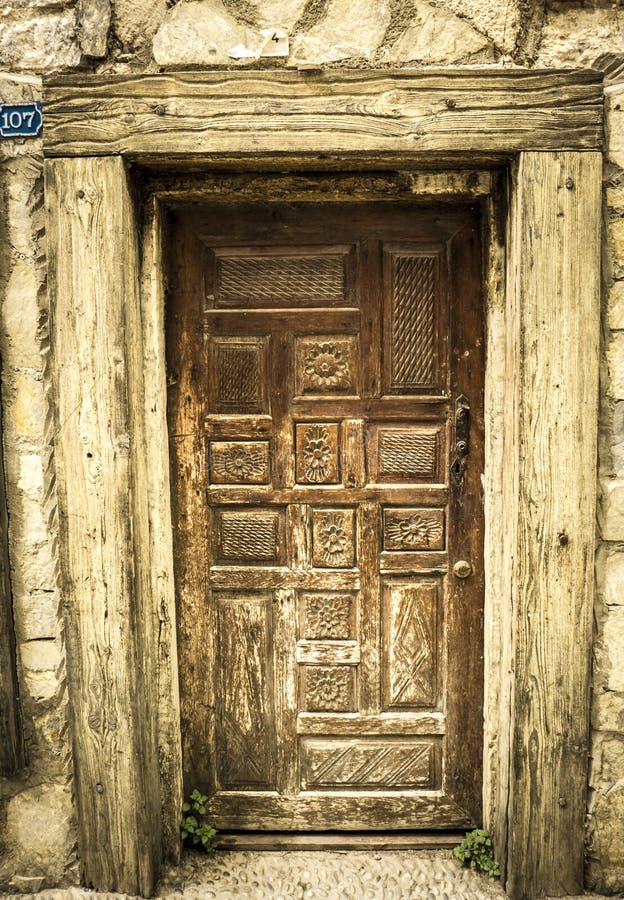 Detail of an antique vintage wooden door in the center of Bodrum. Detail of an antique vintage wooden door in the center of Bodrum.