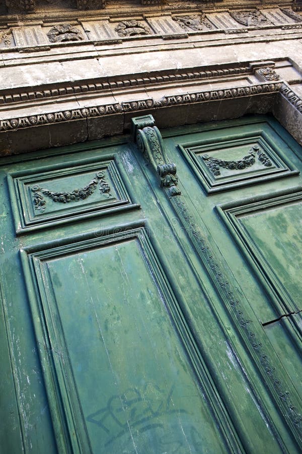 Old wooden door of a French mansion