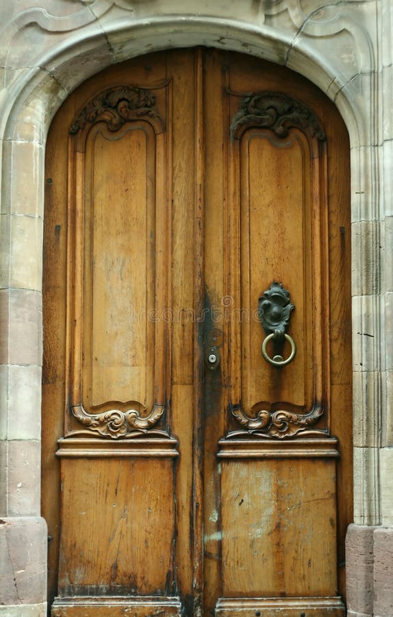 Old wooden door with ornament and original metal