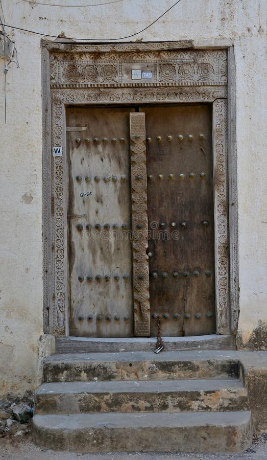 Decorated wooden door in a house in Stone Town, Stone Town, Zanzibar City