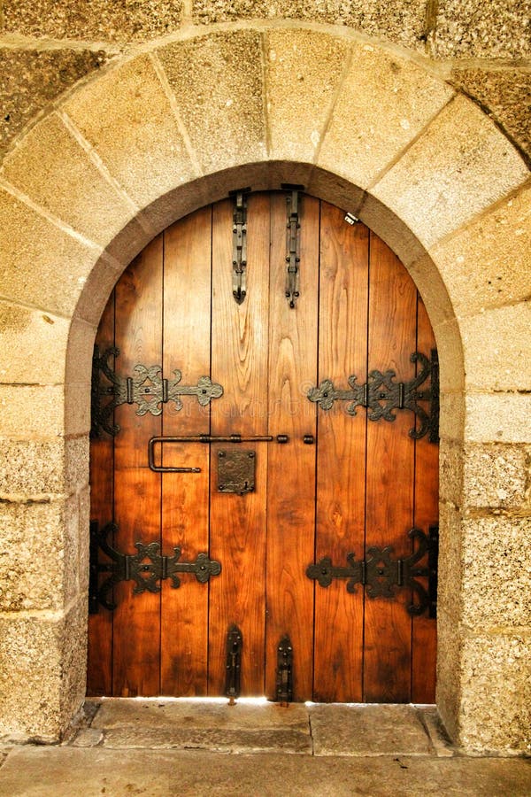 Old wooden door with wrought iron details