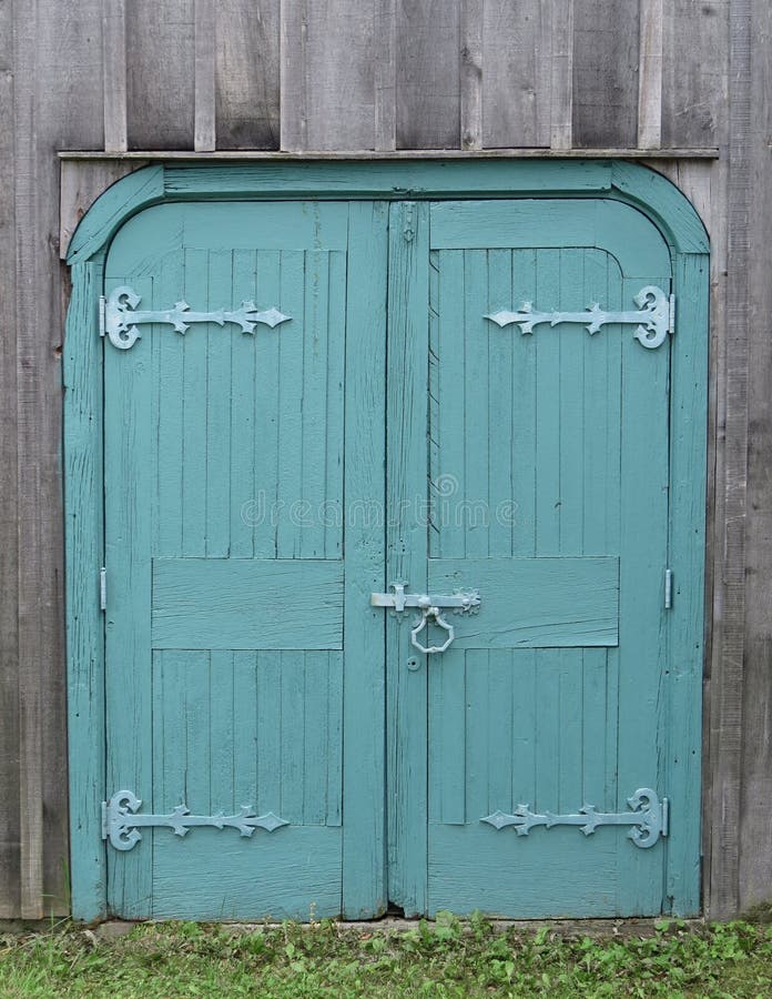 Old wooden double blue doors