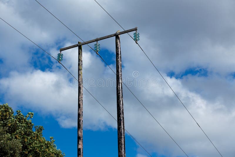 Old Wooden Electric Post Against Blue Sky and Clouds Stock Image Image of equipment, outdoor