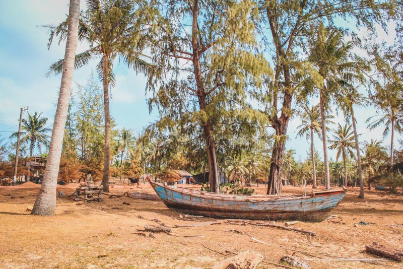 Old wooden fisher boat on land , vintage fisherboat near beach