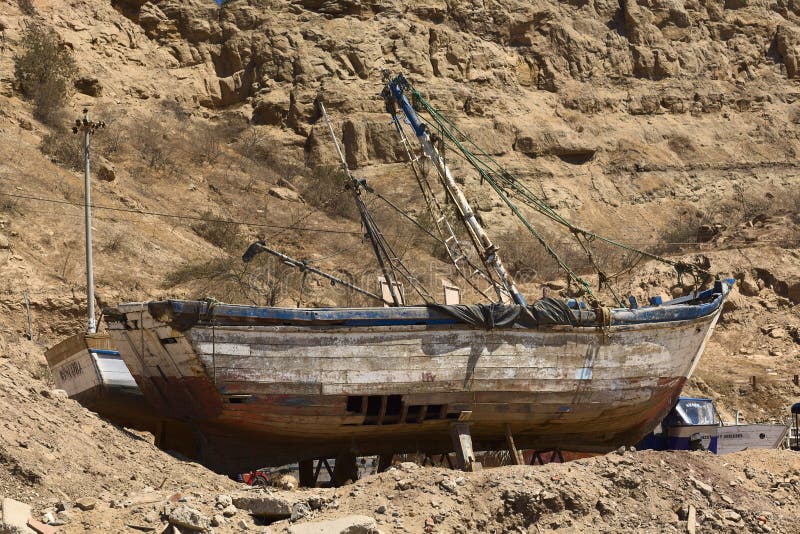 old wooden fishing boat in mancora, peru editorial image