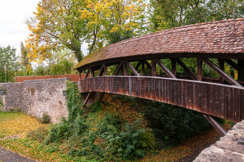 Old wooden half-timbered covered Bridge in Rothenburg Ob Der Tauber