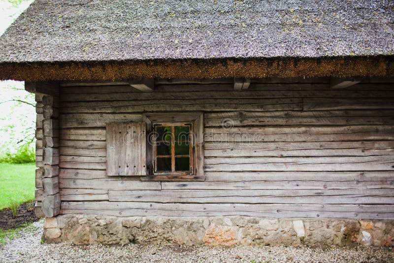 Old wooden house with thatched roof stock photography Old wooden house with thatched roof stock photography