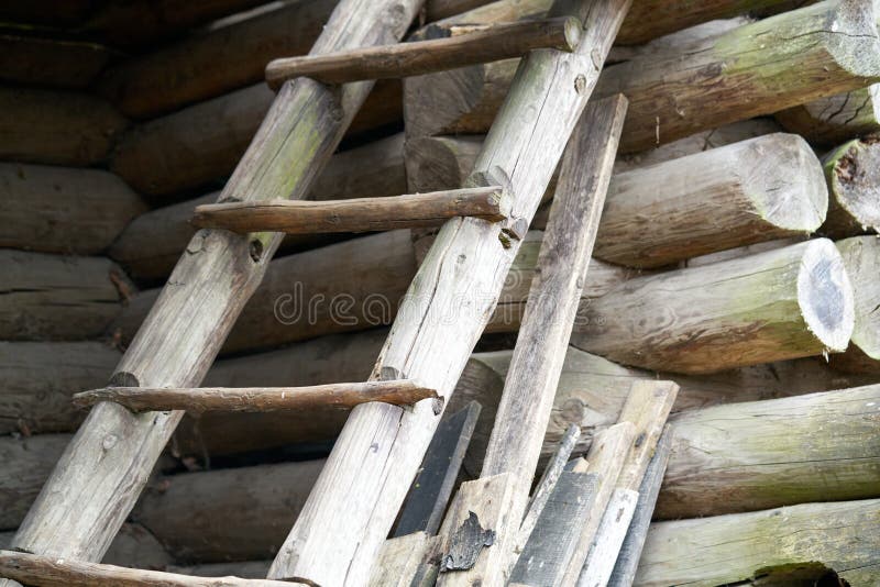 Old wooden ladder in front of historic barn