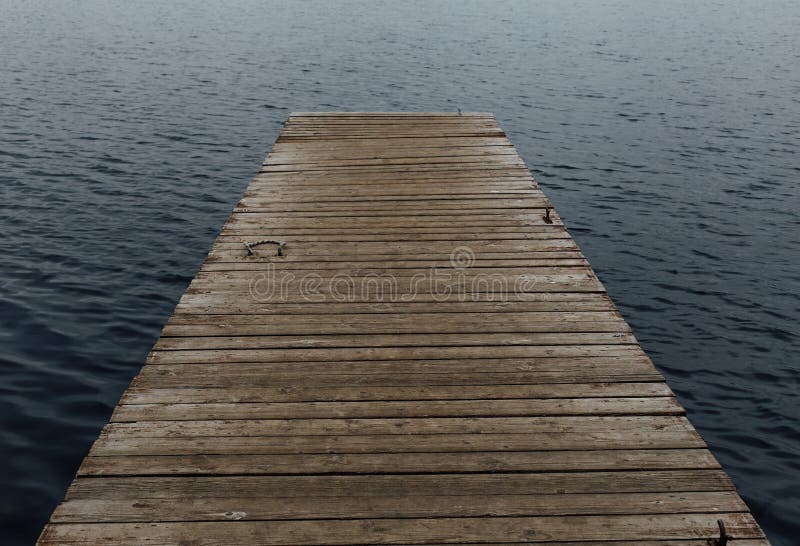 Old wooden jetty on a lake royalty free stock photo Old wooden jetty on a lake royalty free stock photo