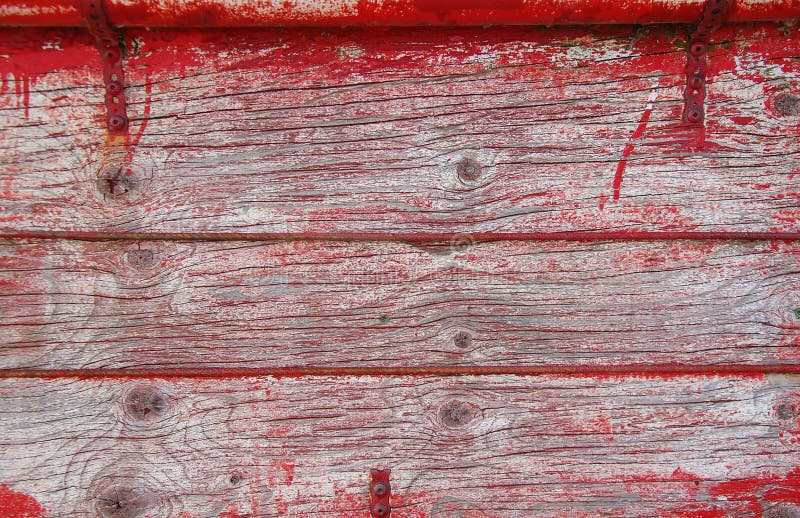 Old wooden planks with traces of red paint