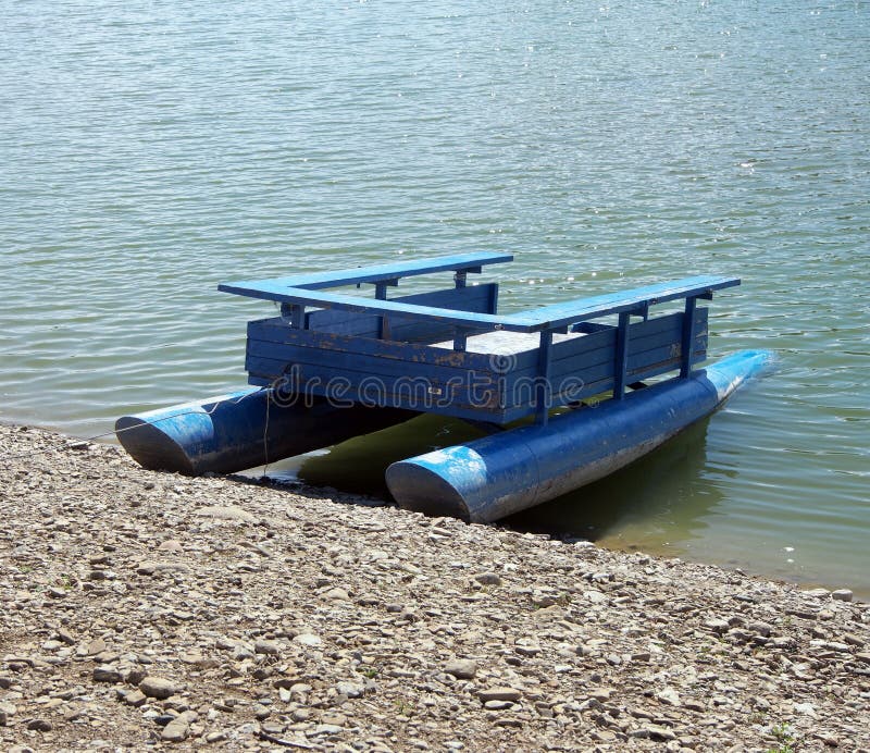 Old Wooden Pontoon Boat on Lake