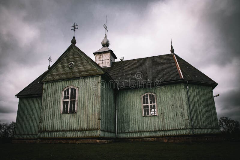 Kalnalis, Lithuania - november 25 2020: An old wooden church stands on the hill.