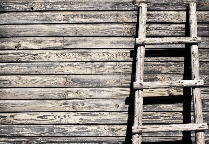 Old wooden wall background with ladder