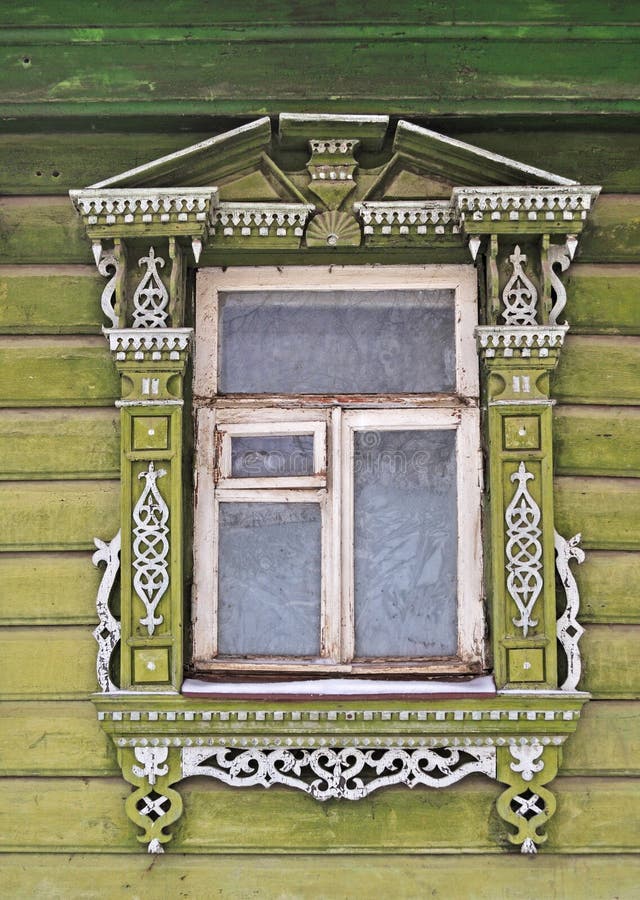 Old wooden window, decorated with carving