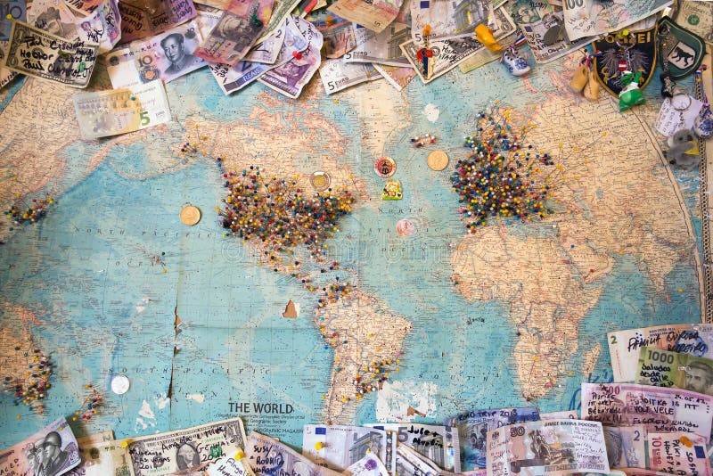 Old world map with marked spaces and money from different countr. World map with marked spaces and money from different countries royalty free stock photos Old world map with marked spaces and money from different countr. World map with marked spaces and money from different countries royalty free stock photos