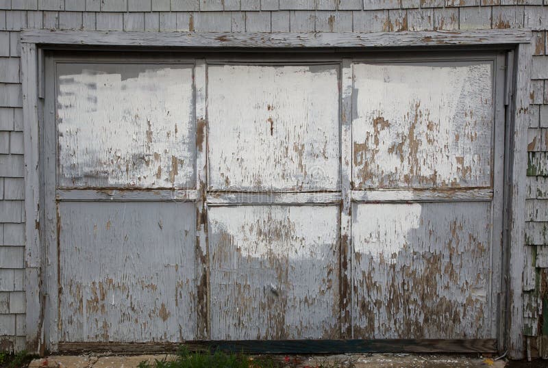 Old worn out gray garage door