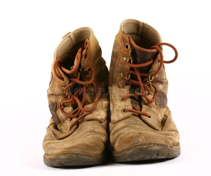 Very old, dirty shoes. Used for traveling. Very old, dirty shoes. Used for traveling.