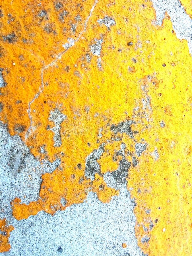 The Old Yellow Paint that Peels Off the Concrete Surface is Unstable