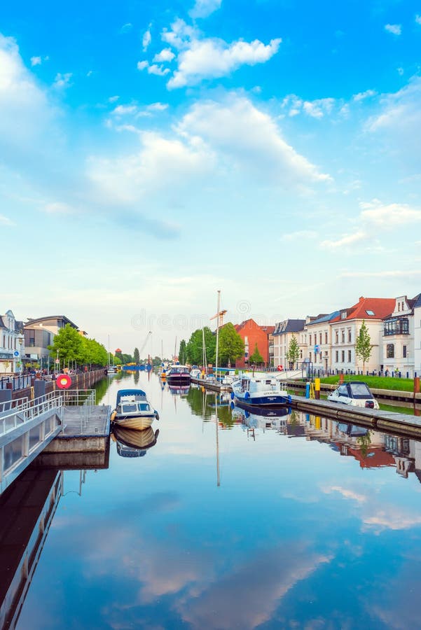 OLDENBURG, GERMANY - MAY 24, 2019: Boats drop anchor in a haven. Vertical stock images OLDENBURG, GERMANY - MAY 24, 2019: Boats drop anchor in a haven. Vertical stock images