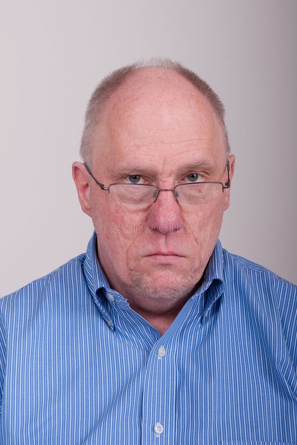 Older Balding Man in Blue Shirt