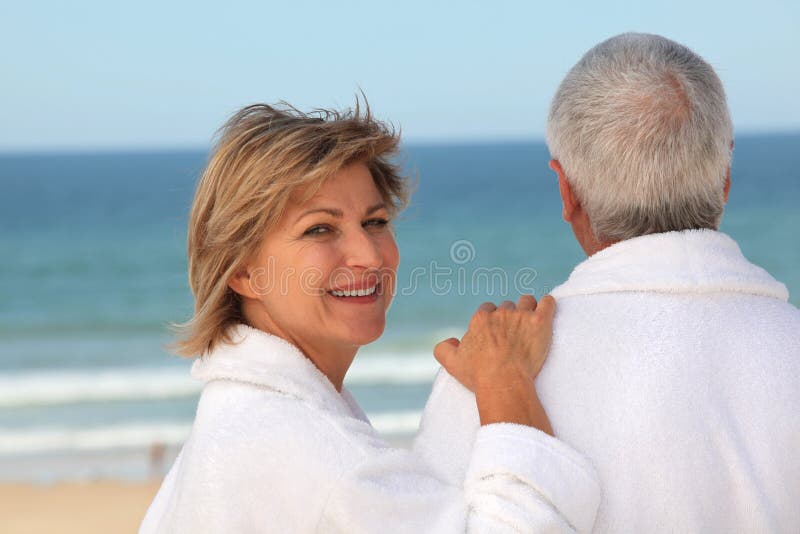 Older couple outdoors in bathrobes